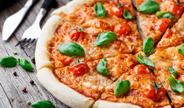 Italian pizza Margherita on a wooden table