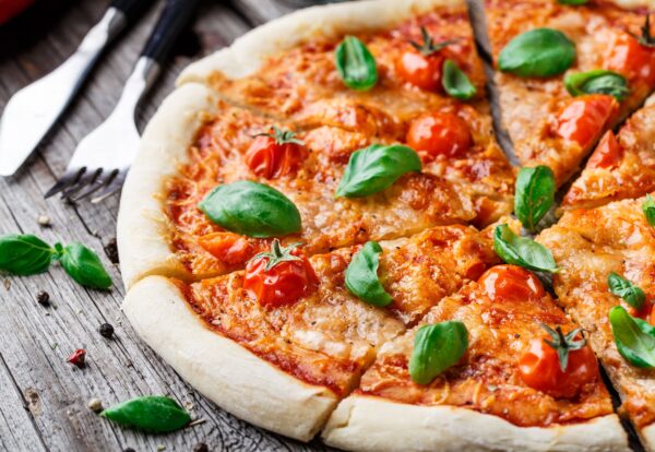Italian pizza Margherita on a wooden table